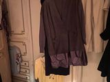 a closet full of clothes and clothes hanging on the wall