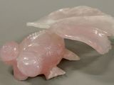 a pink fish that is sitting on a table