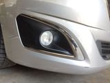 a close up of a car ' s headlight and front bumper