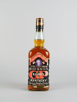 une photo d'une bouteille de bourbon posée sur une table
