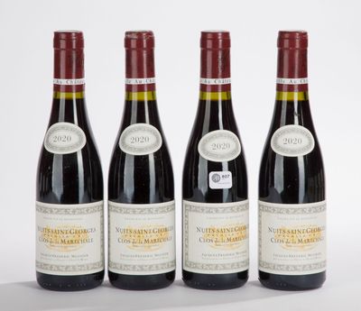 three bottles of wine are lined up on a white surface