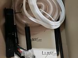 a box with a hose, a hose, and other items in it
