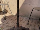 two chairs and a table outside on the patio