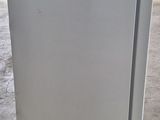 a refrigerator that is sitting in the middle of the floor