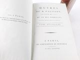an open book with a picture of a person holding it