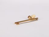 gold plated hair pin with a pearl bead on a white background