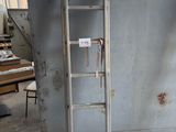a ladder that is leaning against a wall in a room