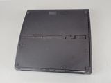 a black sony playstation game console sitting on a table
