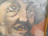 une photo d'un tableau représentant un homme moustachu