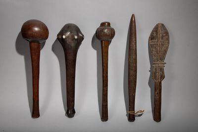 several different types of wooden spoons are lined up on a white surface