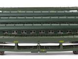 a lot of green train cars that are lined up together