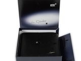 a black box with a black watch inside of it