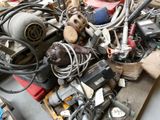 a pile of assorted electrical equipment on a pallet