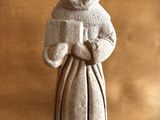 a statue of a woman with a hood on