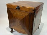 an old wooden box with a drawer on top of it on a white surface