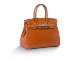 un sac à main en cuir marron sur fond blanc