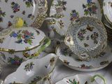many plates and bowls that are sitting on a table