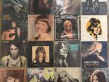 a lot of music cds that are on the table