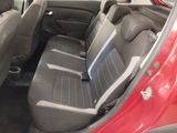 the interior of a red car with grey seats and black trims