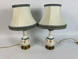 two lamps that are sitting on a white table