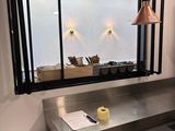 a picture of a kitchen with a sink and a window