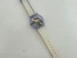 a close up of a wrist watch on a white surface