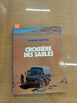 a book on a table with a picture of a truck