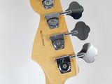 the headstock of an electric guitar with four knobs on a white background