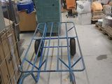 a cart that is sitting in the middle of a warehouse