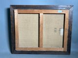an old picture frame with a picture of a couple of doors
