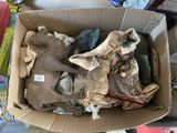 a cardboard box filled with assorted items on a table