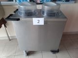 two plastic containers sitting on top of a silver machine