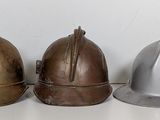 three helmets sitting next to each other on a table