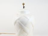an image of a white vase with a light on it