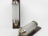 a close up of a lamp on a wooden stand with a white background