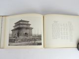 an open book with a picture of a building on it