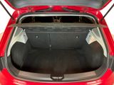 a red car with its trunk open on a white background