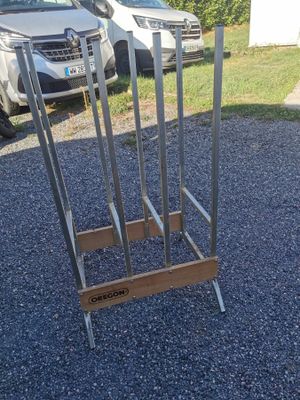 a metal rack that has a bunch of knives on it
