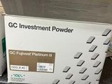 a box of gc investment powder sitting on top of a counter