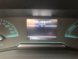 the dashboard of a car with a digital display on it