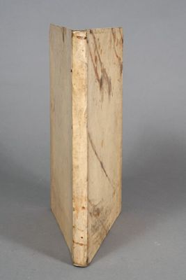 an old book that is sitting on a table