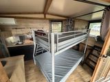 a bunk bed in the middle of a room
