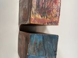 two pieces of wood stacked on top of each other
