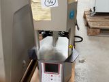 a machine that is sitting on a pallet in a warehouse