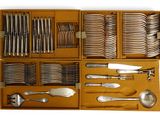 a wooden box with silverware in it on a white background