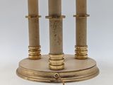 two lamps on a table with a lamp shade on top of it