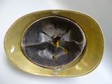 a gold helmet with a hole in the middle of it