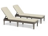 a pair of lounge chairs with beige cushions on a white background