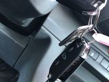 a car key in the center of a car with a keychain attached to it