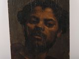 portrait of a man with a beard in a brown shirt